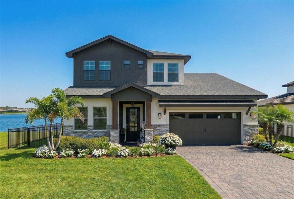 236 Caladium Avenue Lake Alfred, FL 33850 - Photo 1 of 33 a front view of a house with a yard and garage