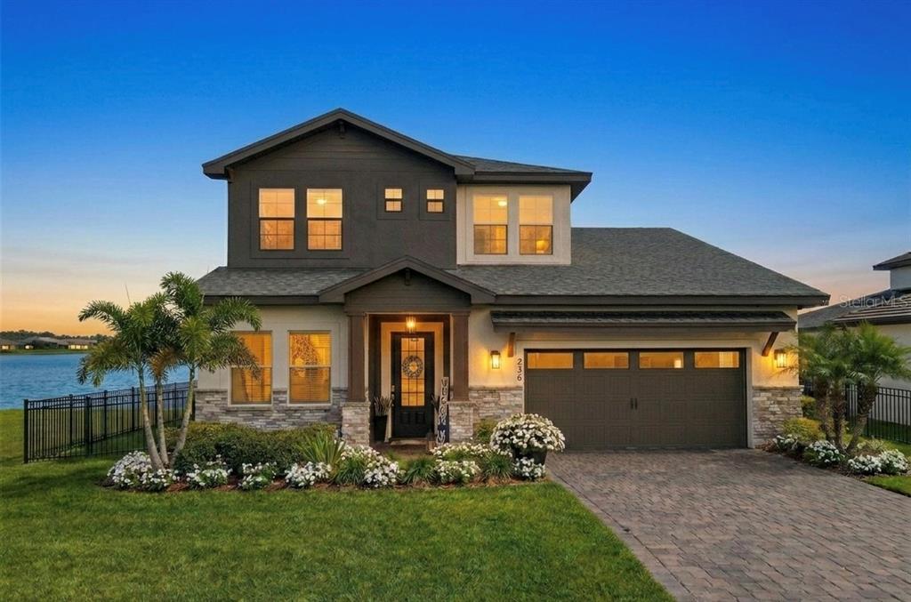236 Caladium Avenue Lake Alfred, FL 33850 - Photo 2 of 33 a front view of a house with a yard