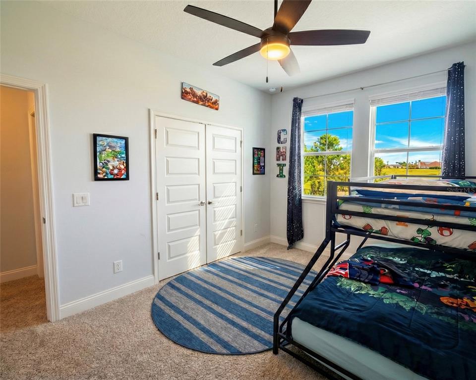 236 Caladium Avenue Lake Alfred, FL 33850 - Photo 22 of 33 a bed room with a bed and a window