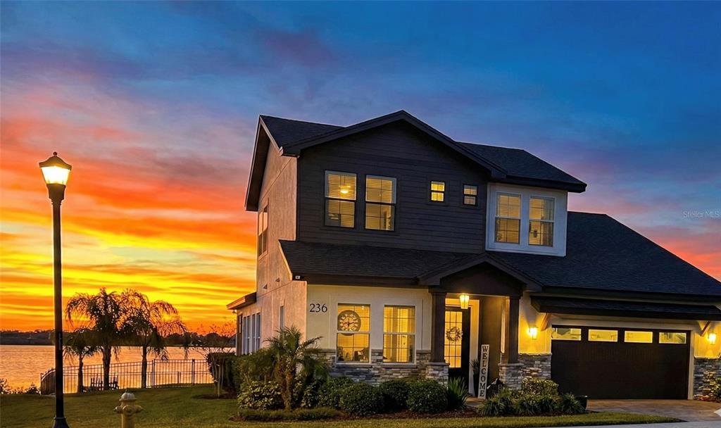 236 Caladium Avenue Lake Alfred, FL 33850 - Photo 5 of 33 a front view of a house with a yard