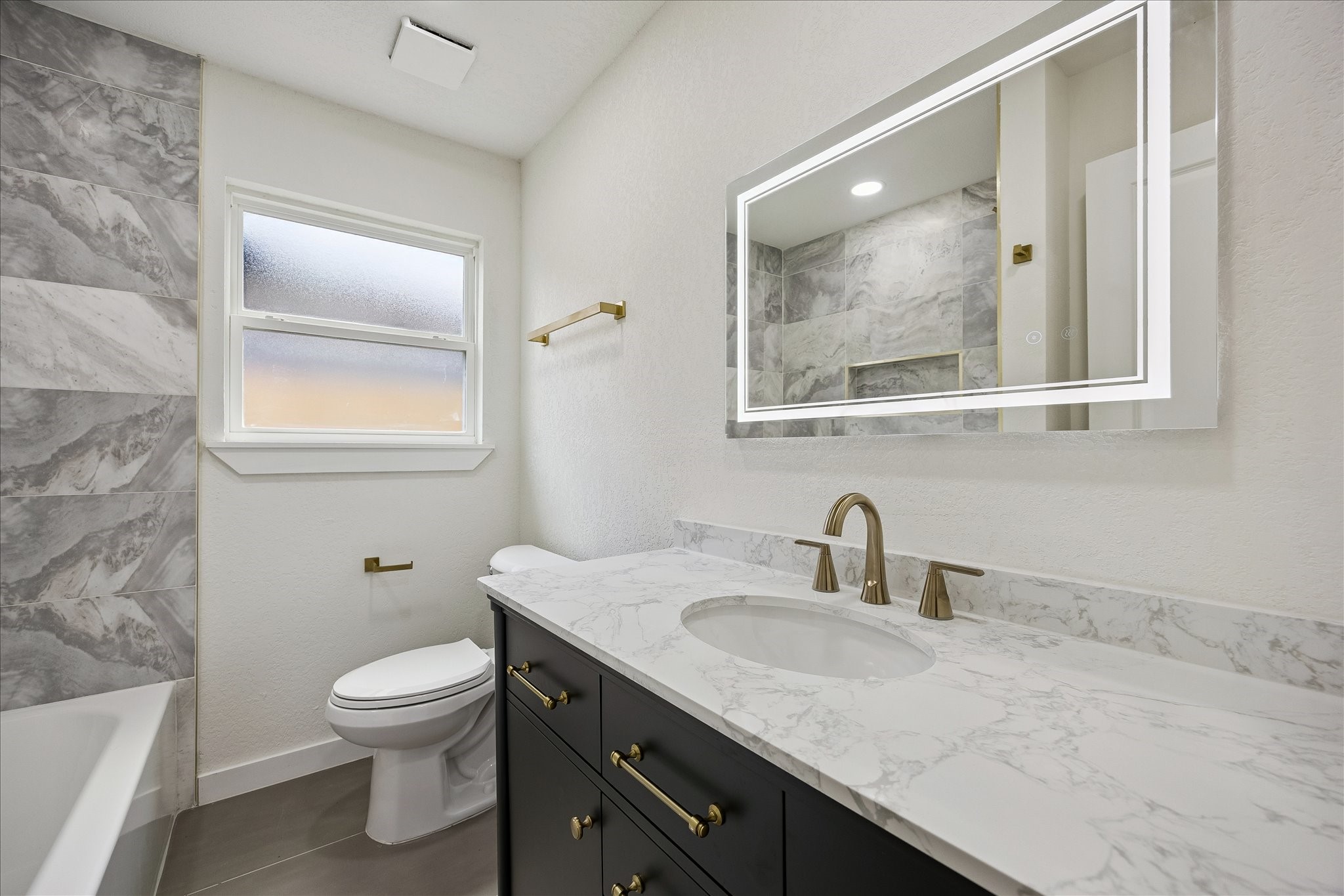 1630 Tabor Street Houston, TX 77009 - Photo 11 of 25 Guest bathroom with ample cabinet space.