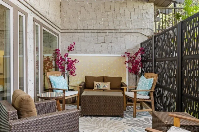 a outdoor space with a couch and potted plant