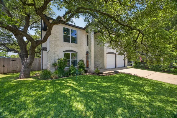 a backyard of a house with lots of green space