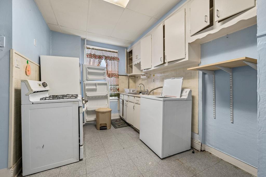 86 Quentin Road Brooklyn, NY 11223 - Photo 11 of 32 a room with storage and utility