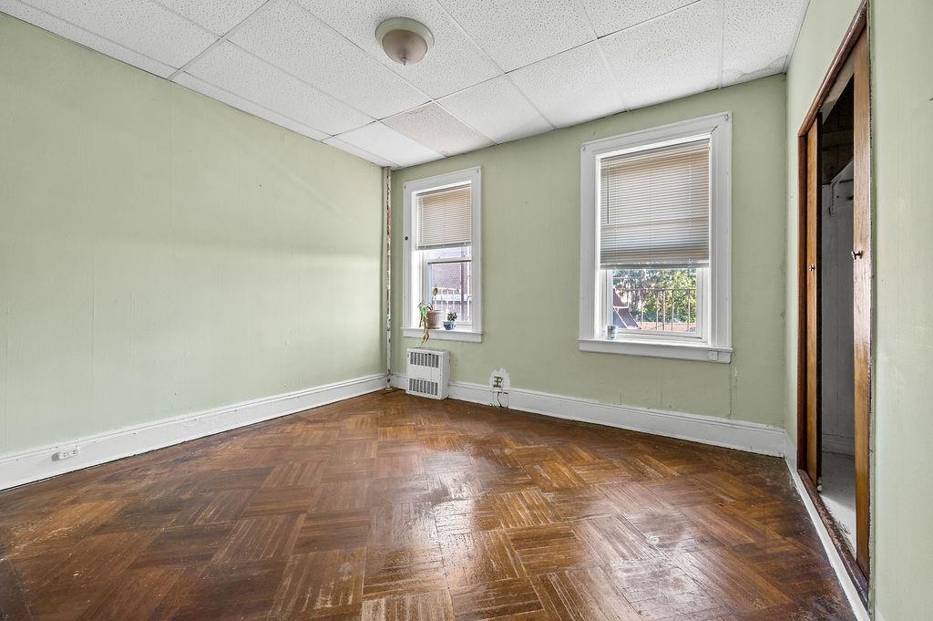 86 Quentin Road Brooklyn, NY 11223 - Photo 12 of 32 an empty room with windows