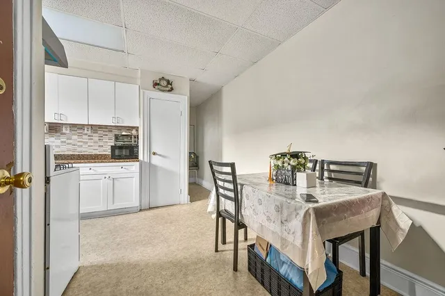 a spacious bedroom with a bed and a window