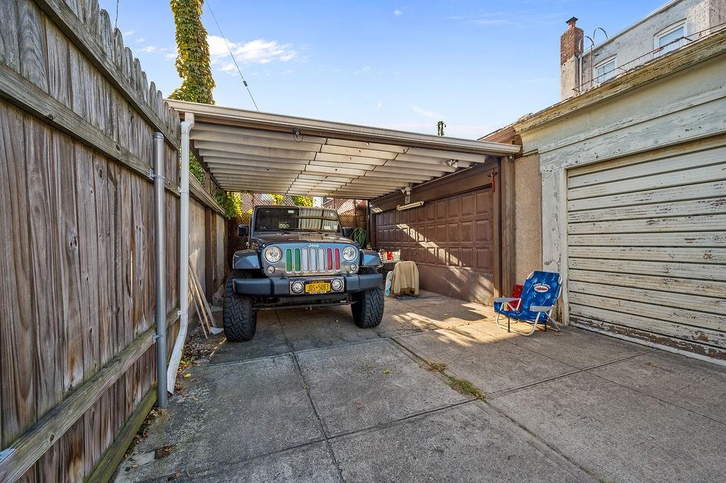86 Quentin Road Brooklyn, NY 11223 - Photo 24 of 32 a view of a garage with parked cars