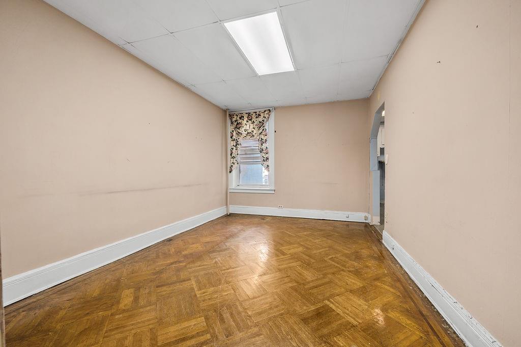 86 Quentin Road Brooklyn, NY 11223 - Photo 10 of 32 an empty room with windows