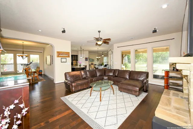 a living room with furniture fireplace and flat screen tv