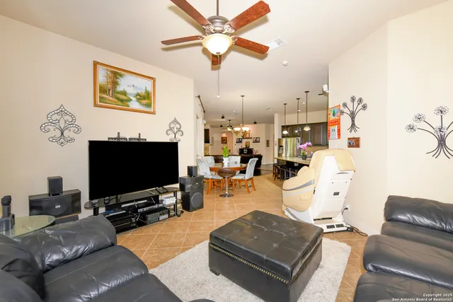 a living room with a bed furniture and a window