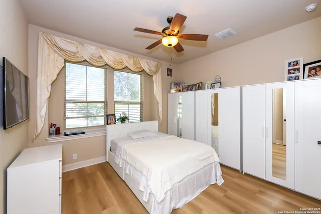 a bedroom with a bed and furniture