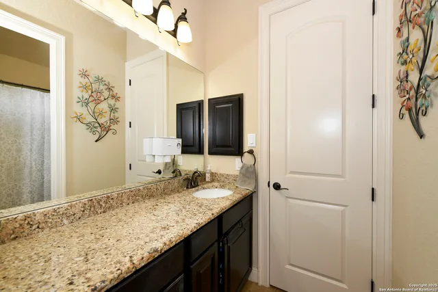 a bathroom with a shower curtain and a toilet