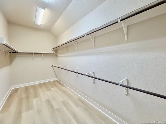 a view of a room with racks on the wall