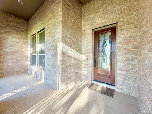 a view of a glass door of the house