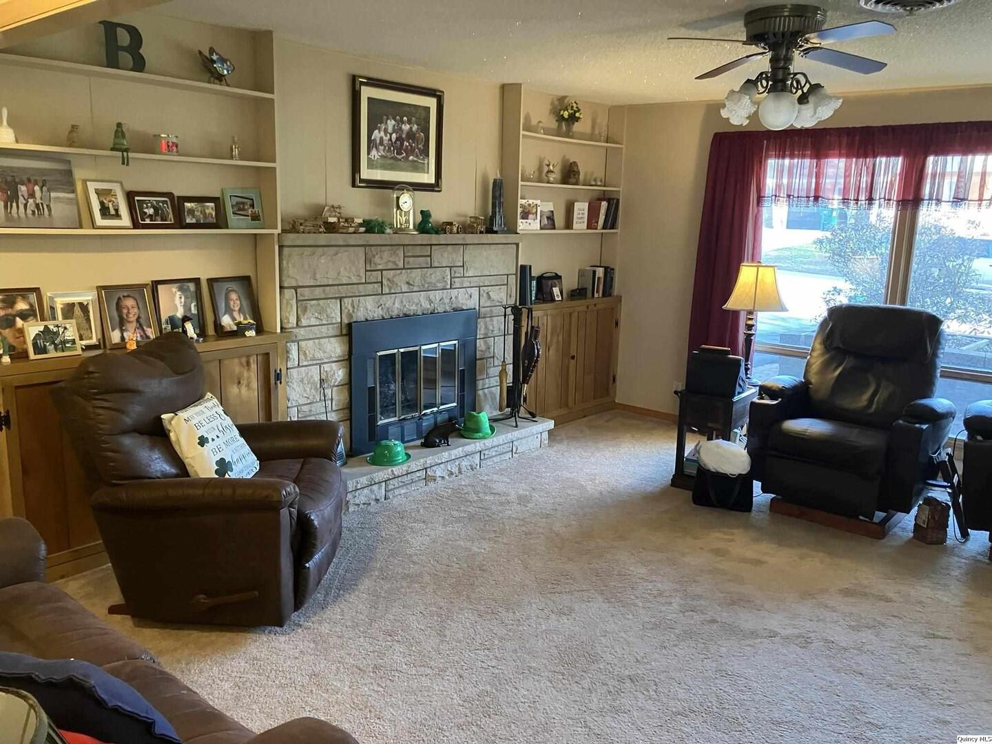 2524 Southbrook Road Quincy, IL 62305 - Photo 11 of 32 a living room with furniture and a fireplace