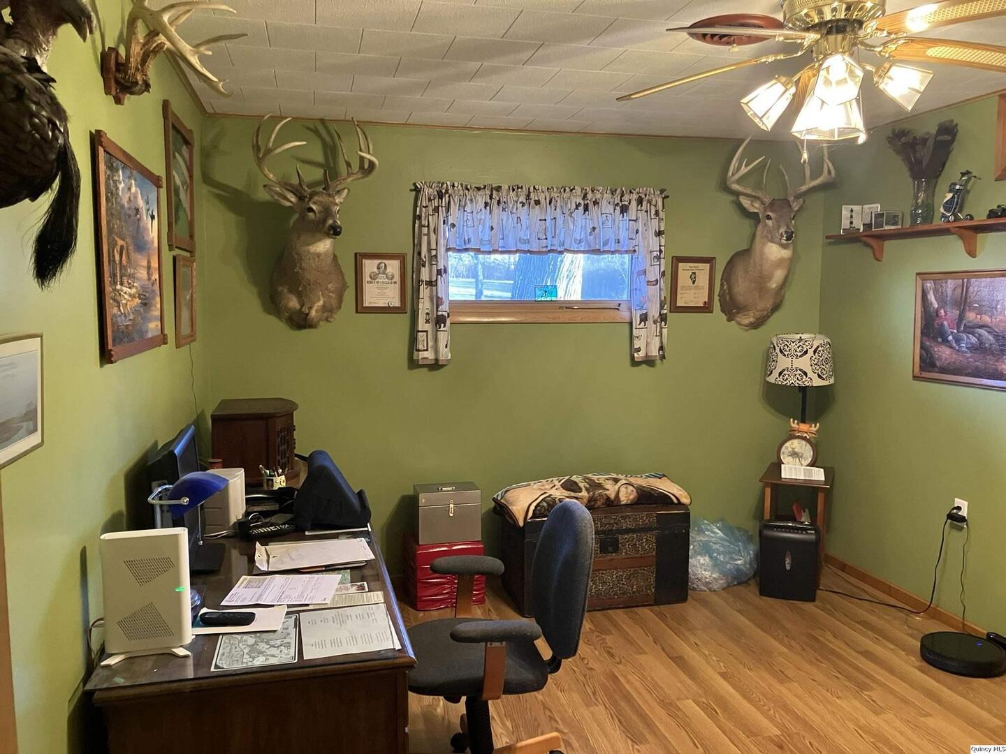 2524 Southbrook Road Quincy, IL 62305 - Photo 12 of 32 a bedroom with a bed and a chair