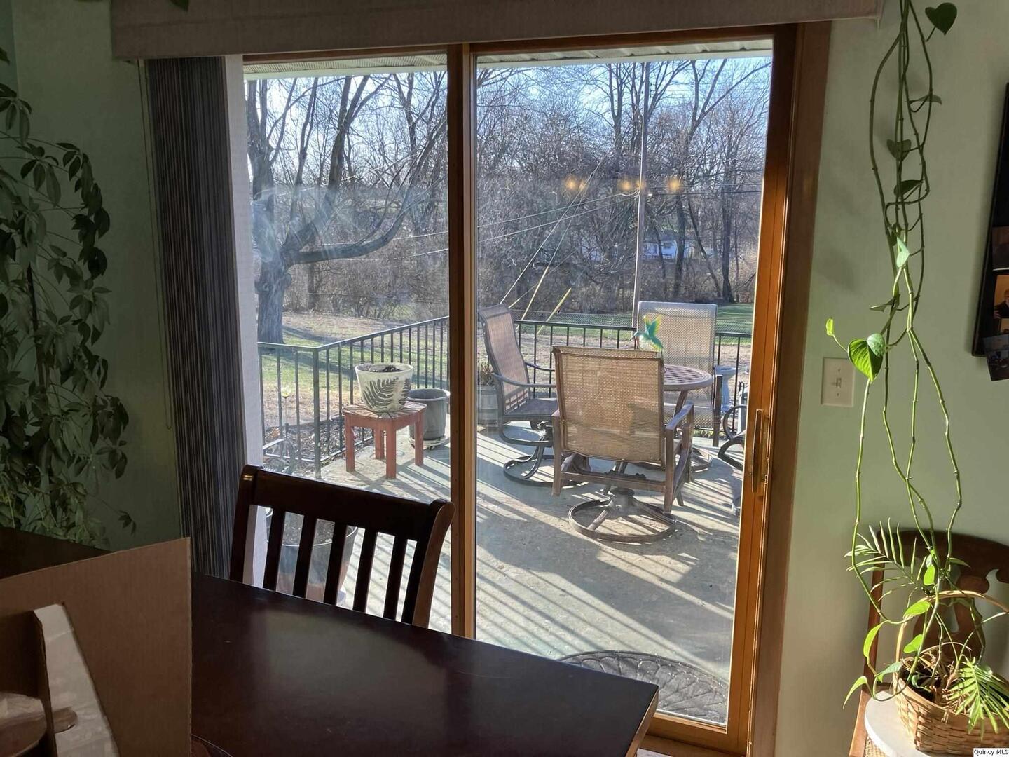 2524 Southbrook Road Quincy, IL 62305 - Photo 14 of 32 a view of a porch with a table and chairs
