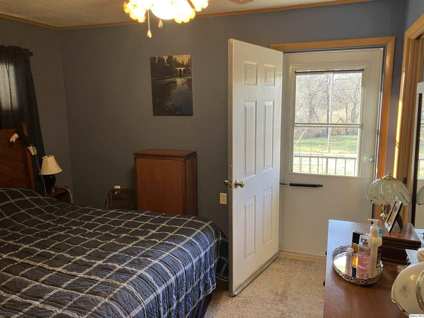 2524 Southbrook Road Quincy, IL 62305 - Photo 16 of 32 a bedroom with a bed and window