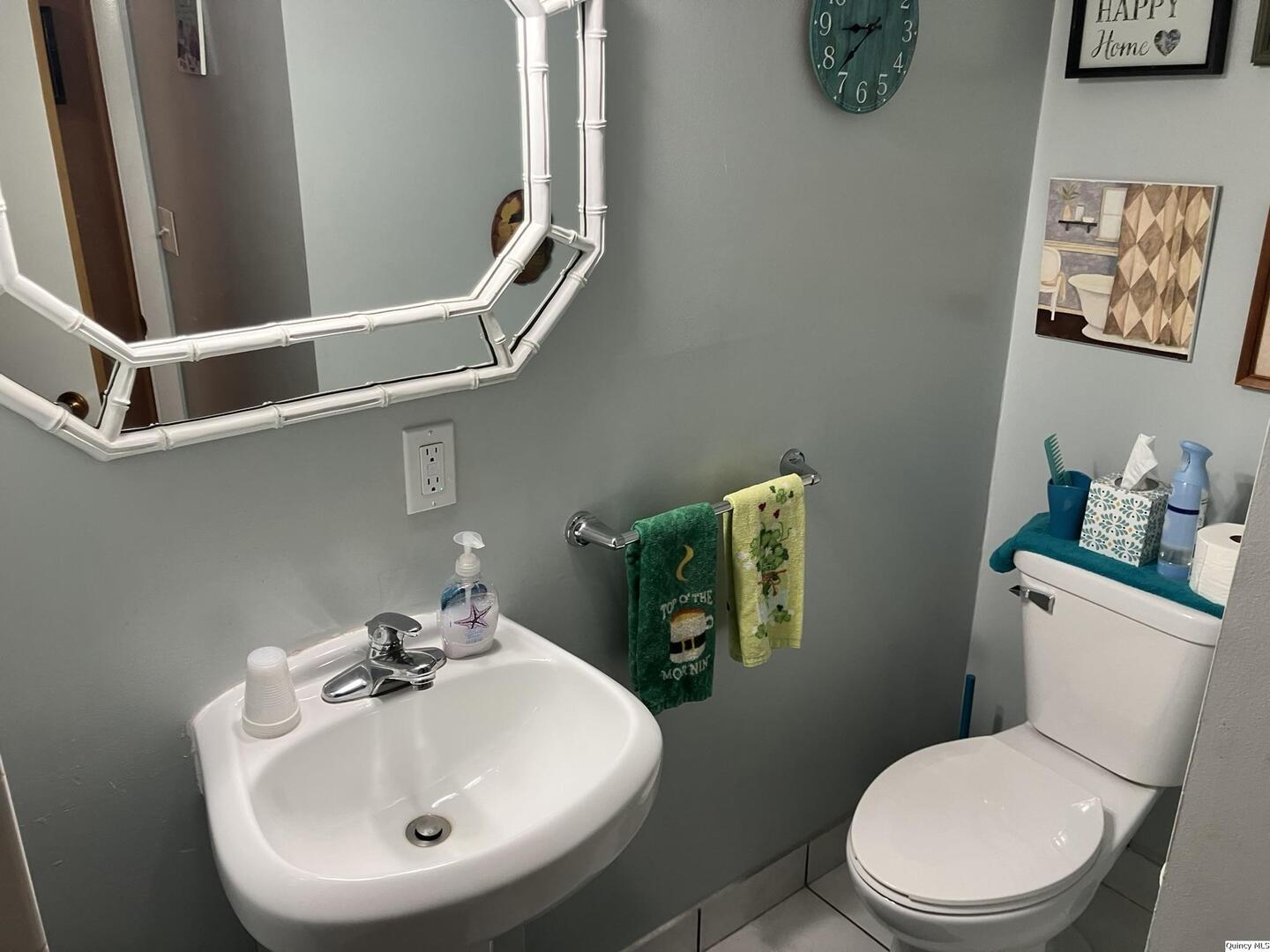 2524 Southbrook Road Quincy, IL 62305 - Photo 19 of 32 a white toilet sitting next to a bathroom sink