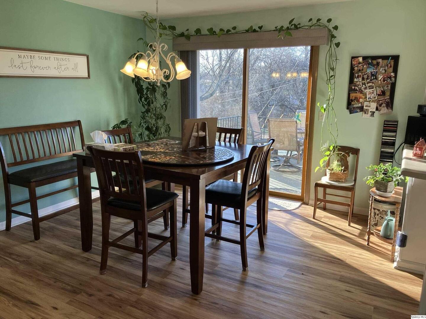 2524 Southbrook Road Quincy, IL 62305 - Photo 3 of 32 a dining room with furniture a chandelier and wooden floor