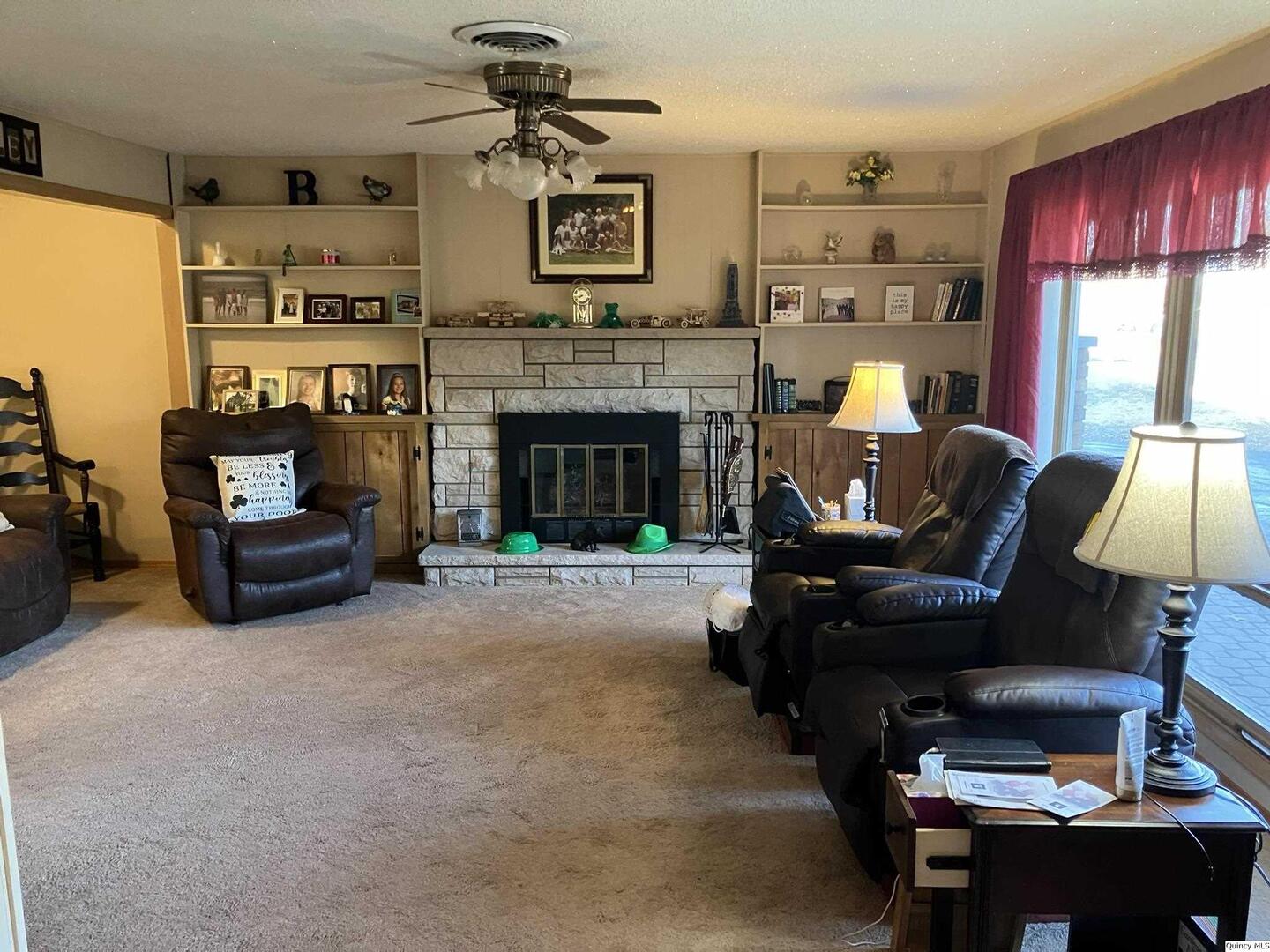 2524 Southbrook Road Quincy, IL 62305 - Photo 5 of 32 a living room with furniture and a fireplace