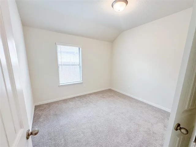 a bathroom with a sink mirror and tub