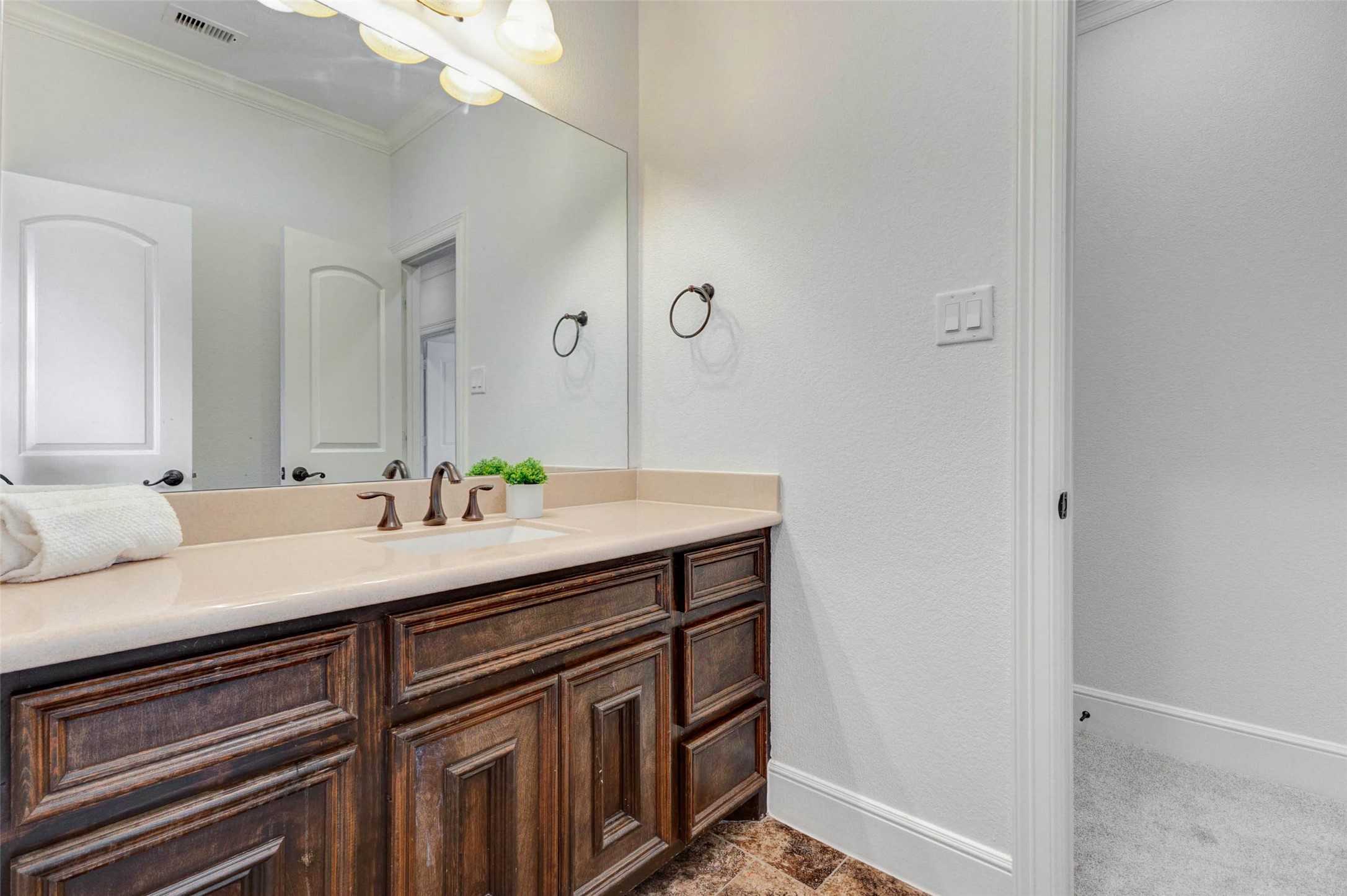 5327 Whitmore Fulshear, TX 77441 - Photo 36 of 50 The well-appointed vanity offers abundant storage and everyday functionality with rich cabinetry and quality finishes.