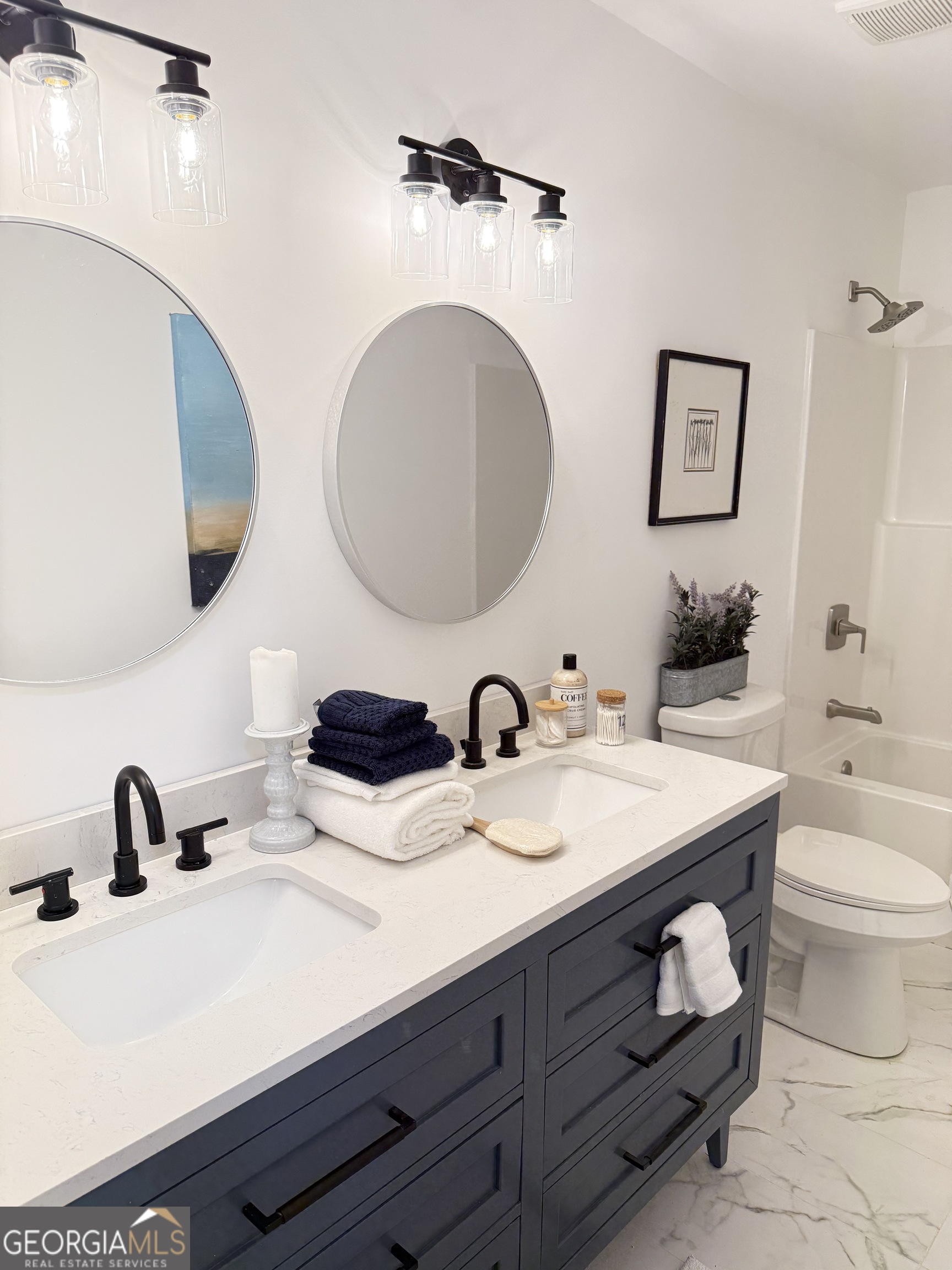 3925 Pineshore Circle Gainesville, GA 30501 - Photo 18 of 18 a bathroom with a double vanity sink mirror and toilet