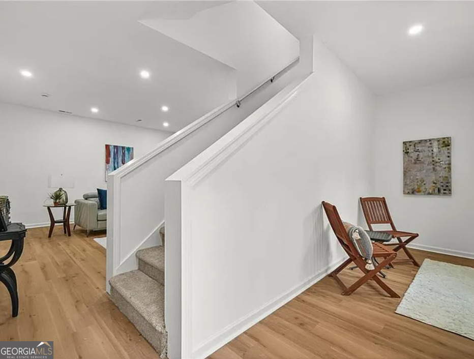 3925 Pineshore Circle Gainesville, GA 30501 - Photo 10 of 18 a view of a hallway with wooden floor and chair