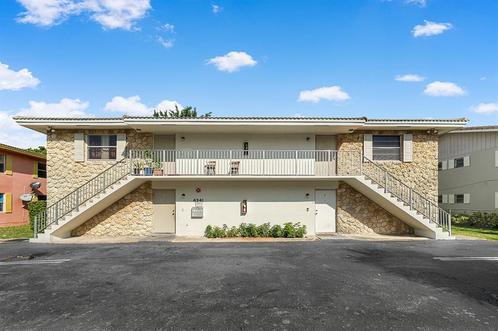 a view of a house with a street