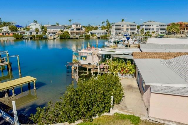 50 137th Ave Circle Madeira Beach, FL 33708 - Photo 2 of 19 a view of a lake with boats and trees in the background