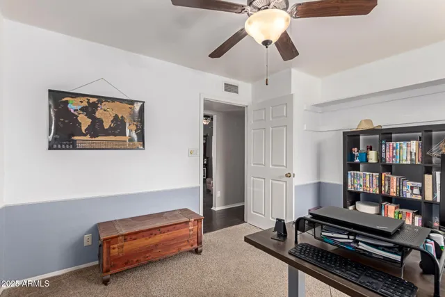 a bathroom with a sink a toilet and shower curtain