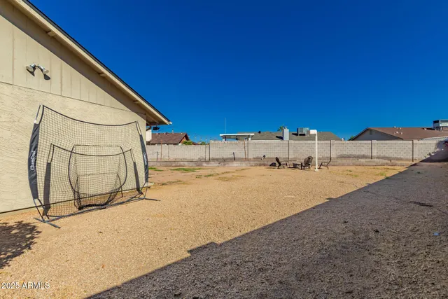 a view of house with outdoor space and sitting area