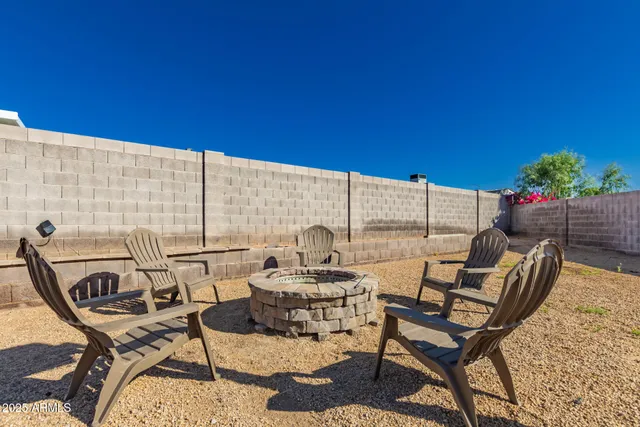a view of an entryway with a table and chairs