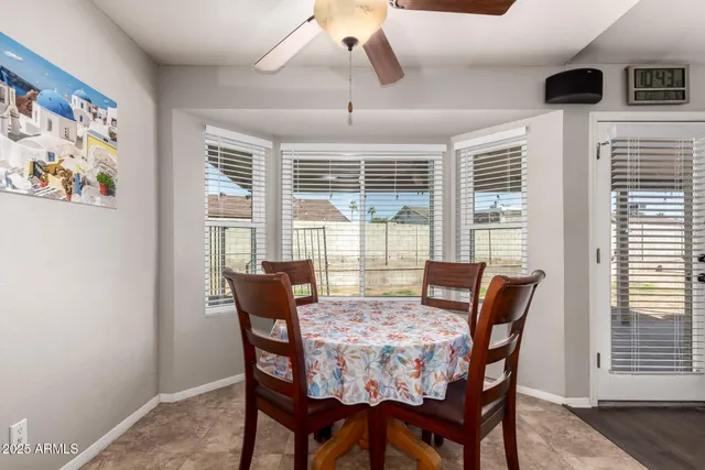a kitchen with granite countertop a sink stove and refrigerator
