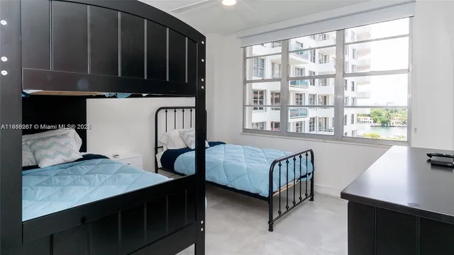 a bedroom with furniture and a window