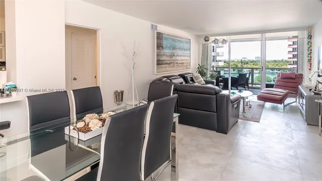a view of a livingroom with workspace and a window