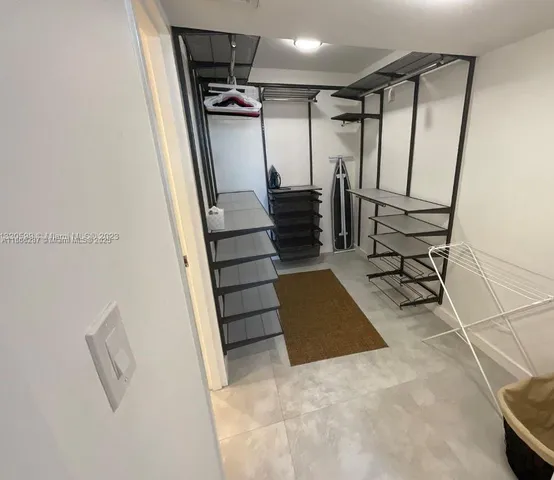 a view of entryway with stairs and a wooden floor