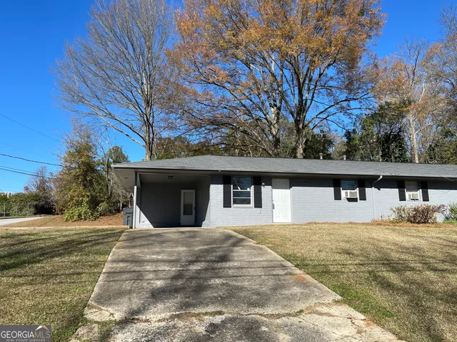 a view of house with yard