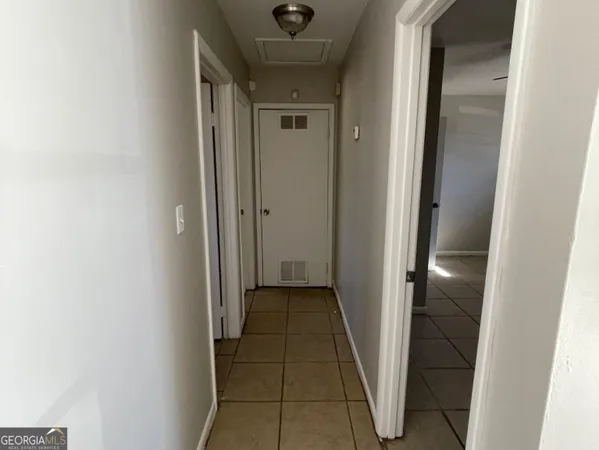 a view of an empty room and window