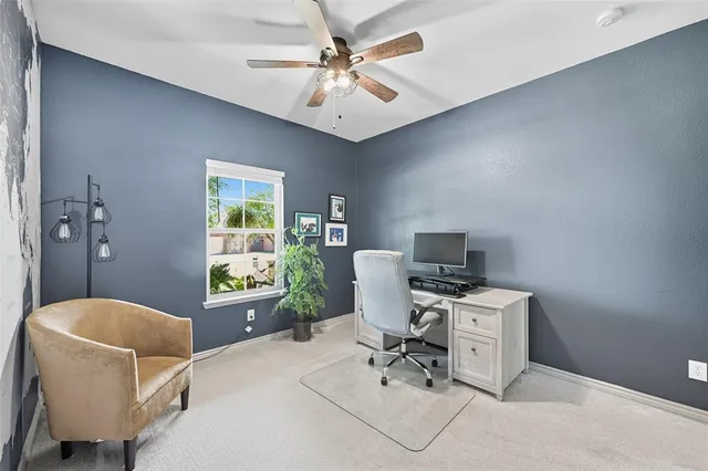 a workspace with furniture and a window