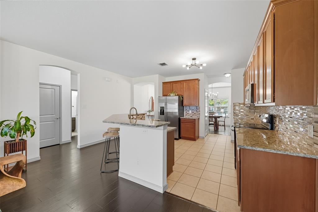 308 Sheridan Road Oak Point, TX 75068 - Photo 7 of 20 a kitchen with a refrigerator and a sink