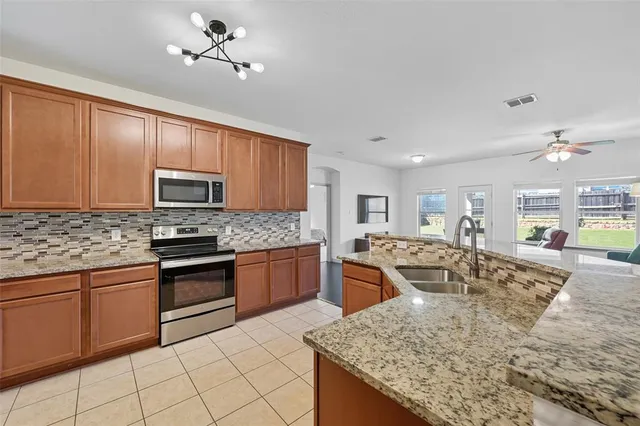a large kitchen with cabinets
