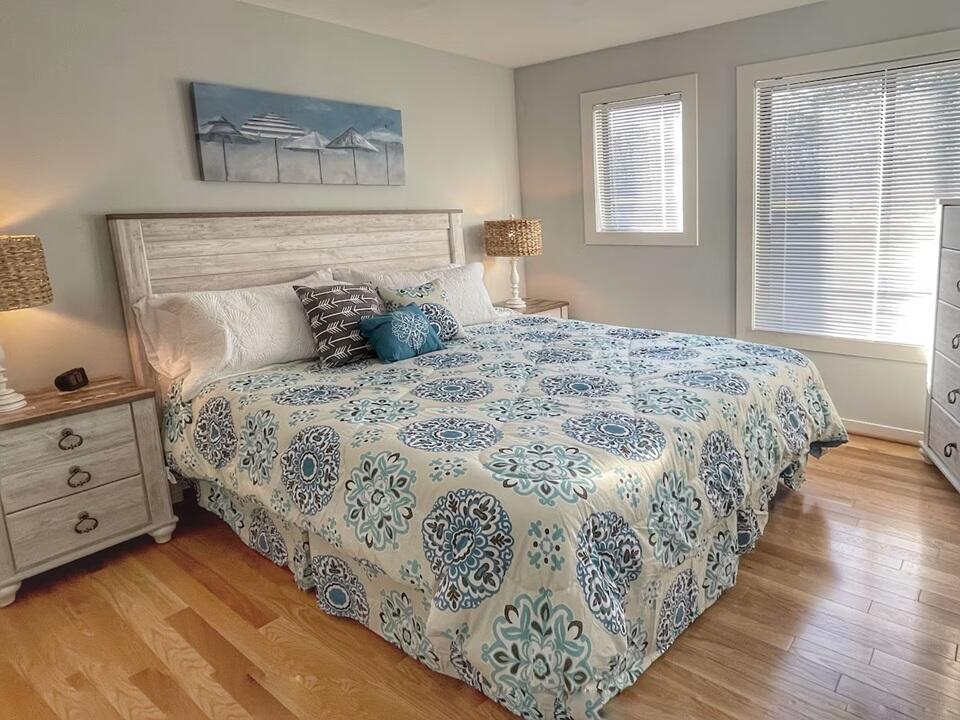 290 Sailors Cove Drive, Unit 405 Moneta, VA 24121 - Photo 7 of 22 a bedroom with a bed and a window