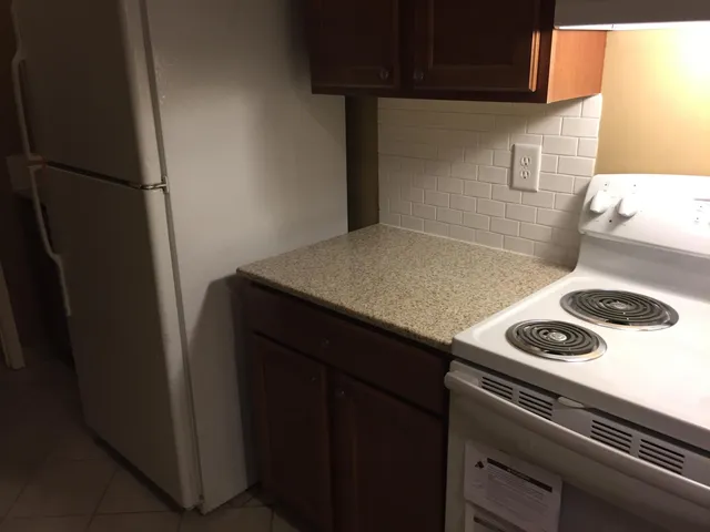 a bathroom with a sink toilet and mirror