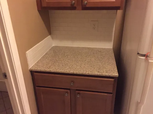 a kitchen with a stove and a microwave