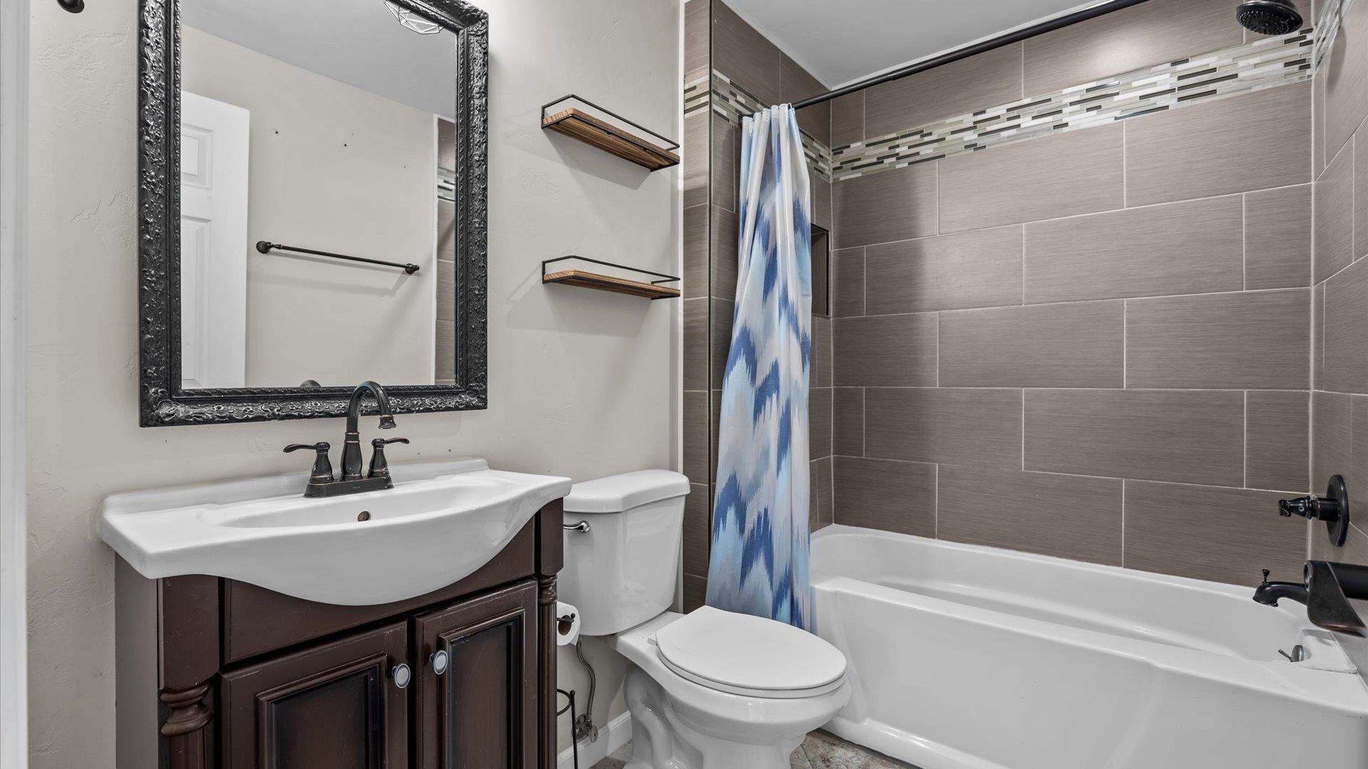 1055 Glenwood Drive Grand Junction, CO 81503 - Photo 16 of 27 a bathroom with a sink toilet and shower
