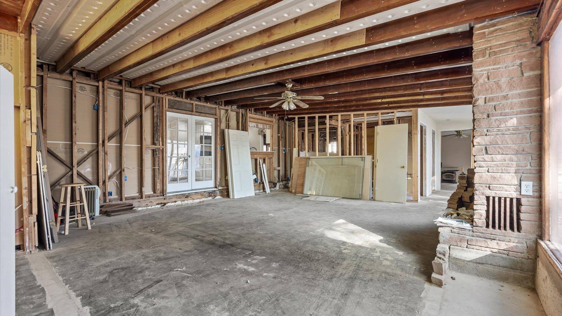 1055 Glenwood Drive Grand Junction, CO 81503 - Photo 19 of 27 a view of a hallway with wooden floor and windows