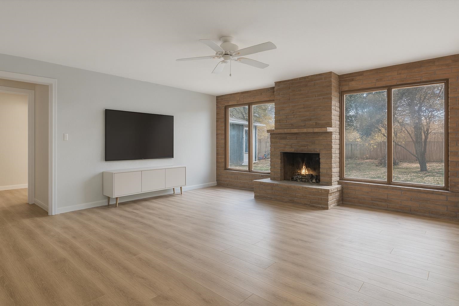 1055 Glenwood Drive Grand Junction, CO 81503 - Photo 26 of 27 a view of an empty room with a fireplace and a window