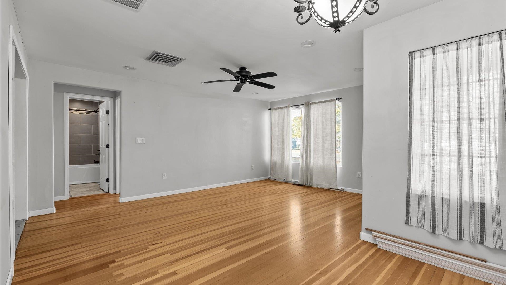 1055 Glenwood Drive Grand Junction, CO 81503 - Photo 7 of 27 a view of a livingroom with a window and a ceiling fan